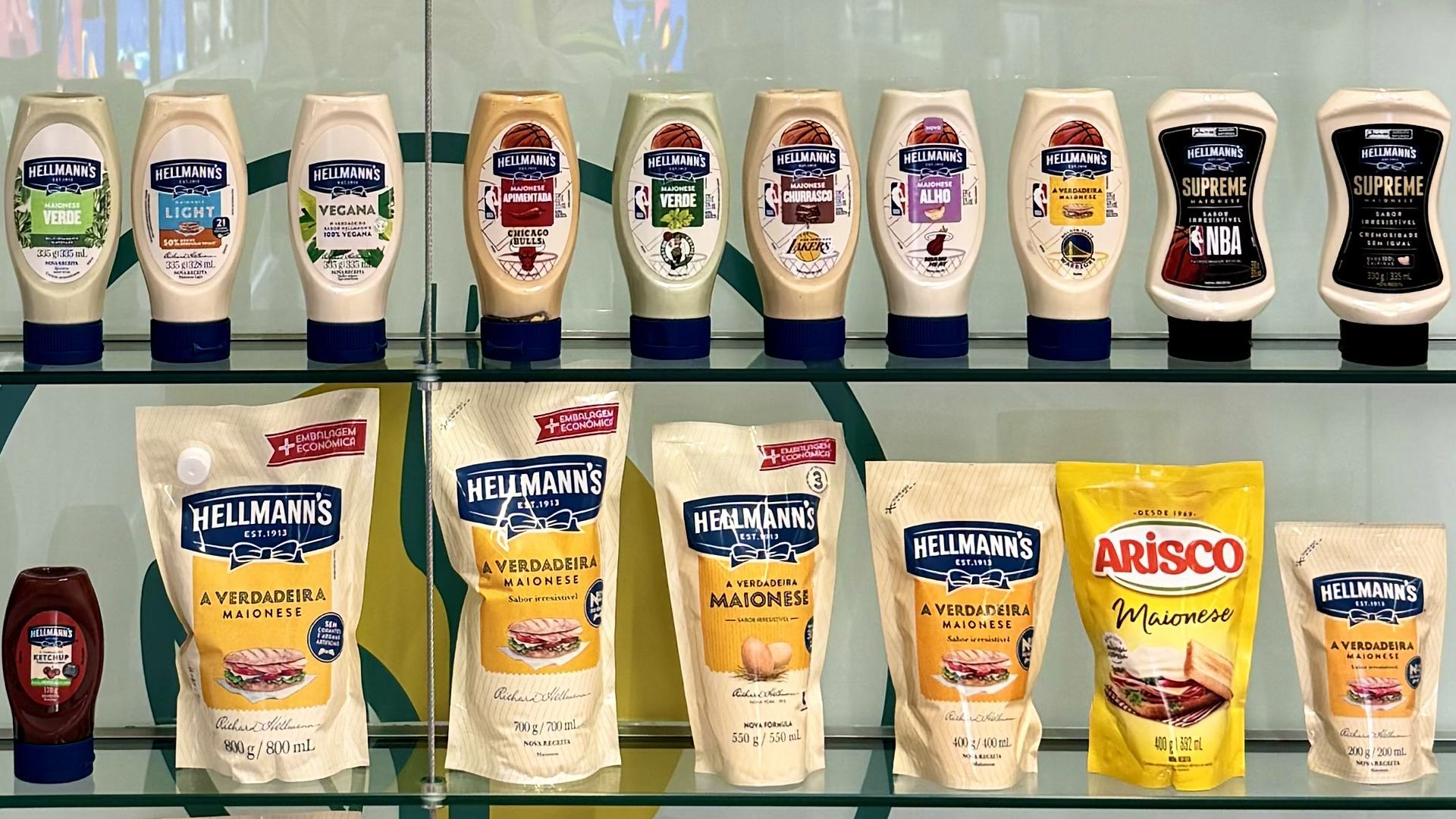 17 Hellmann's mayonnaise products on a glass shelf 