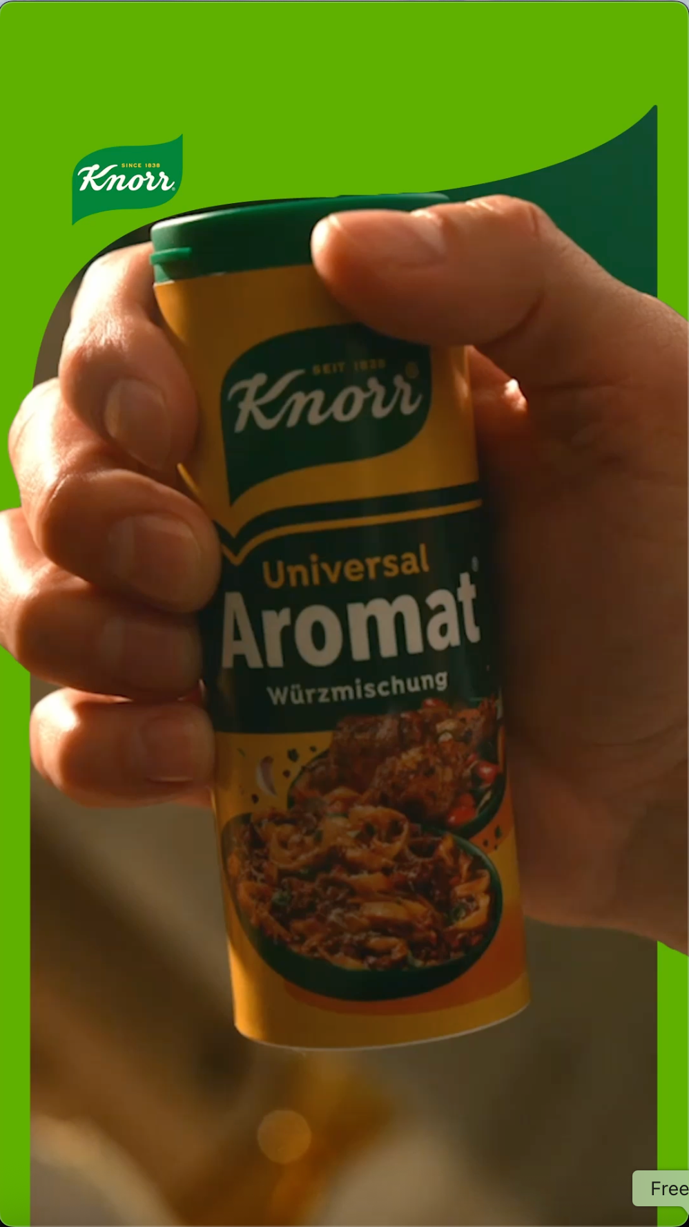 A hand grabbing a container of Knorr Universal Aromat to use as a condiment while cooking.