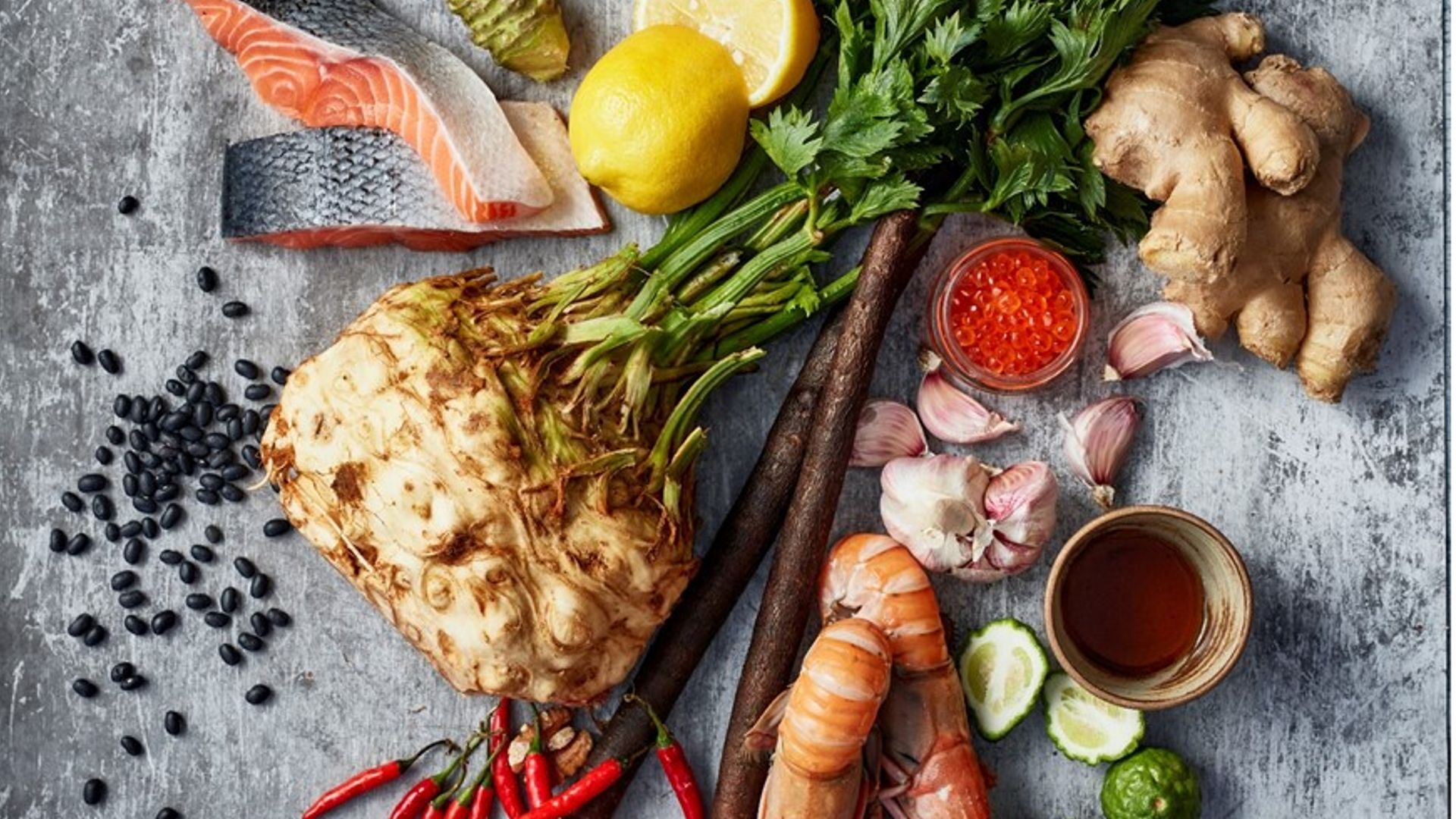 A selection of herbs and foods including red meat, bay leaves and hummus 