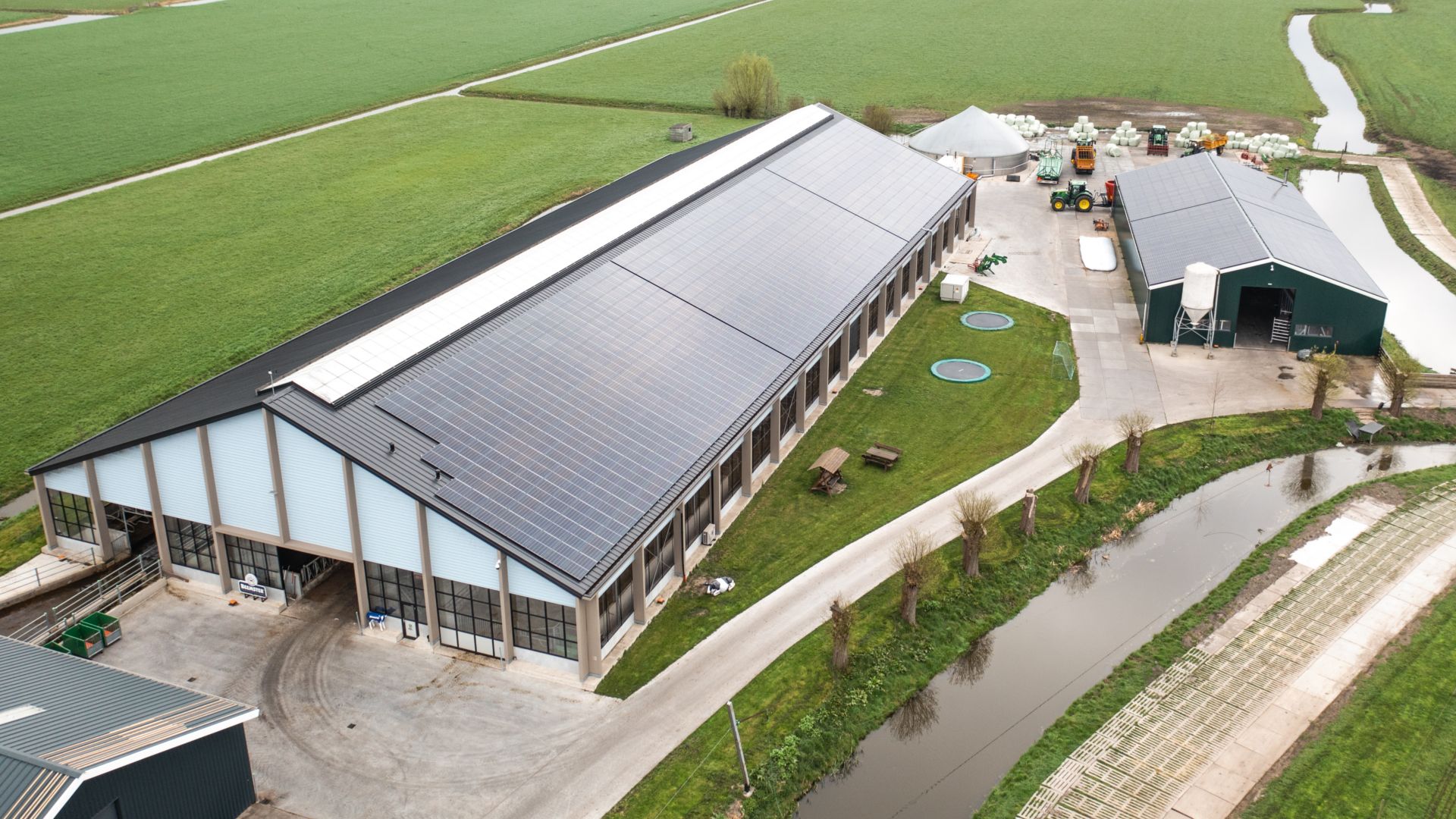 Aeroplane view of a factory surrounded by grass 