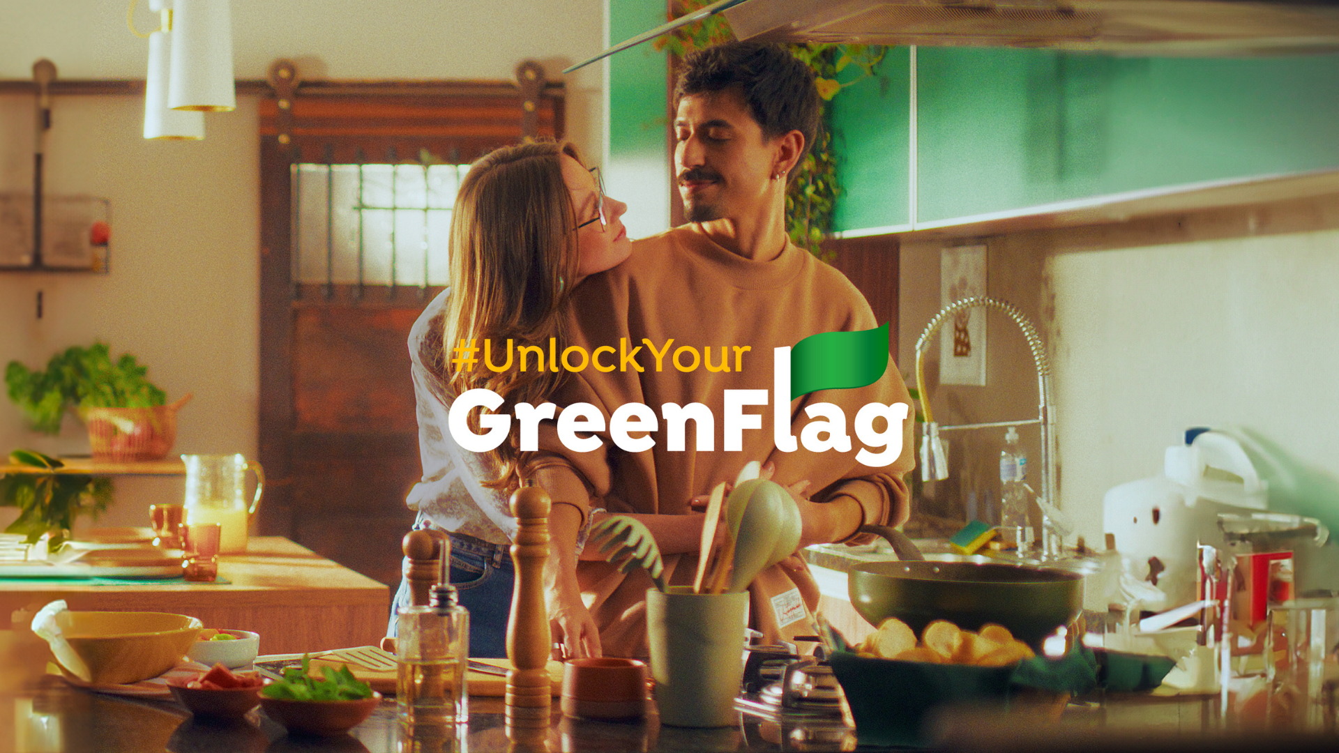 A woman hugs a man who is cooking in this ad supporting Knorr’s Green Flag social-first campaign
