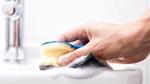Person cleaning basin with sponge. A Domestos campaign educated people on the importance of safe cleaning with bleach.