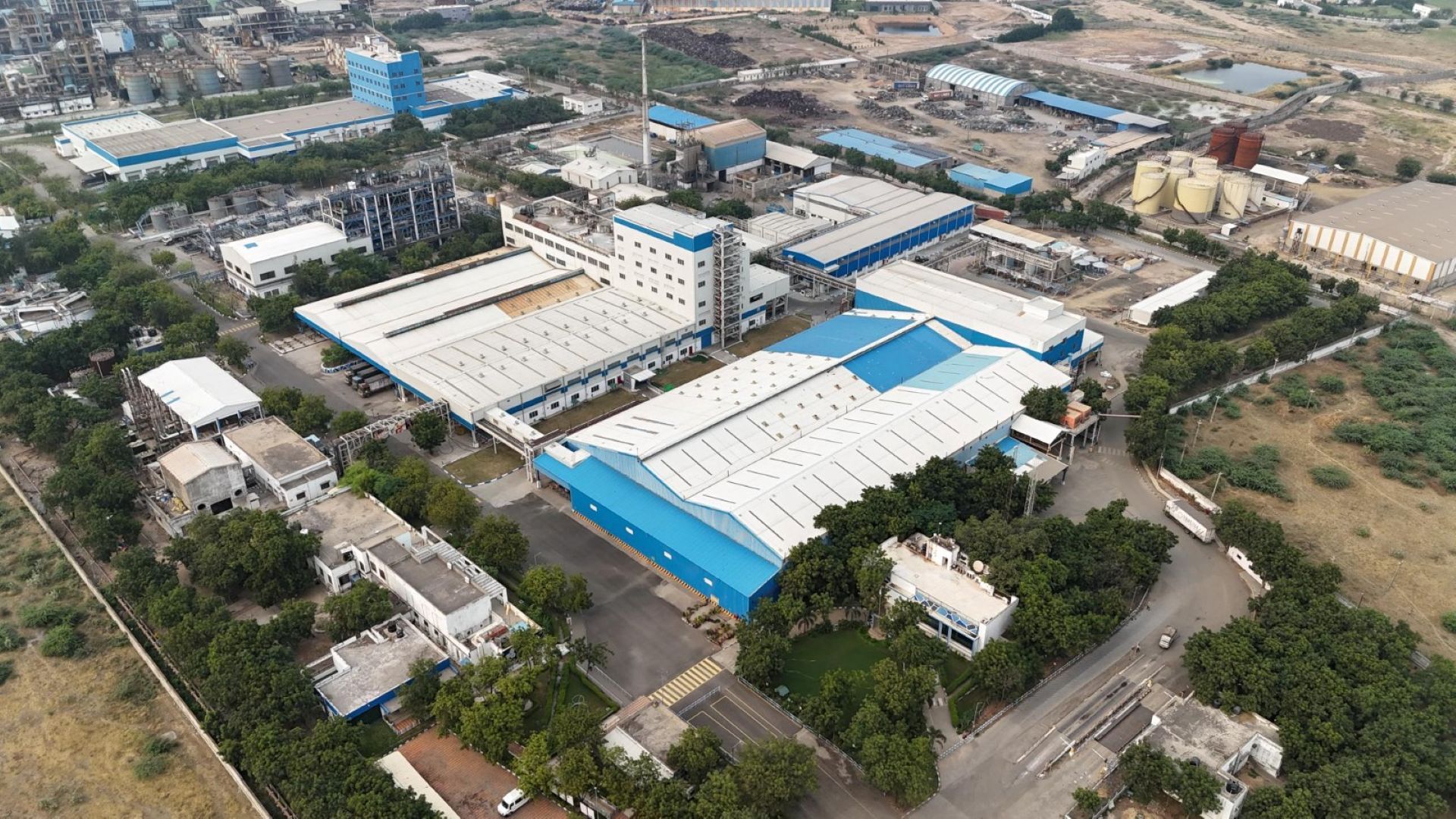 An aerial view of Unilever’s Gandidham factory in India, a vast manufacturing facility in white and blue.