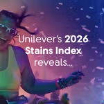 A person wearing a bright green top and colourful bracelets dances at a lively event with confetti falling in the air. The scene is lit with vibrant purple and blue lights. Text on the image reads: “Unilever’s 2026 Stains Index reveals…” and the Unilever logo appears in the top right corner.