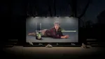 A billboard features an advert of a man with a moustache and curly hair lying on the floor behind a can of Axe Catnip. The image says: If her cat likes you, you will get apprrrroved. The billboard is scented with Axe Catnip and below it you can see six cats.