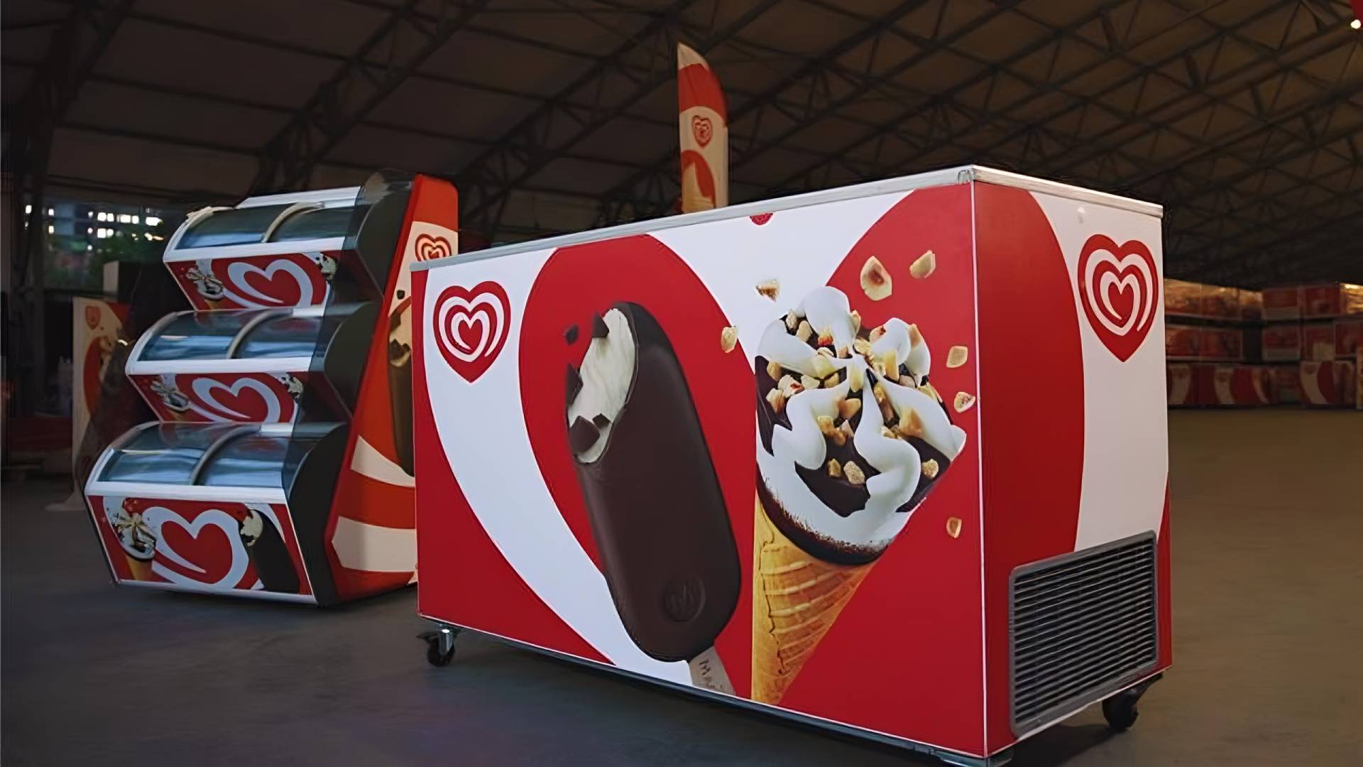 An example of a cabinet and an upright vending machine ice cream freezer, both enabled with AI to gather stock insights