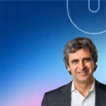 Unilever Q1 2026 results graphic featuring a portrait of Fernando Fernandez, Unilever Chief Executive Officer, shown on the right against a blue gradient background with a curved Unilever ‘U’ design element.