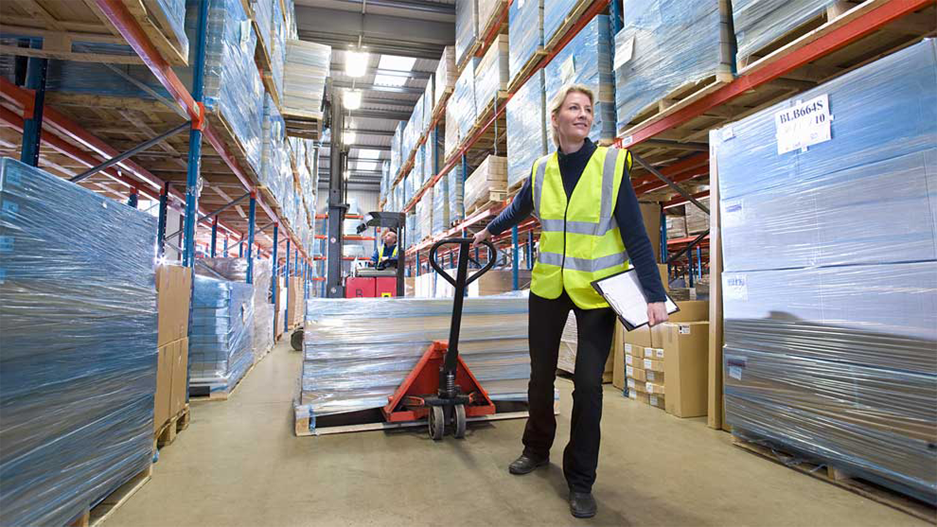 Photo of female warehouse worker in factory