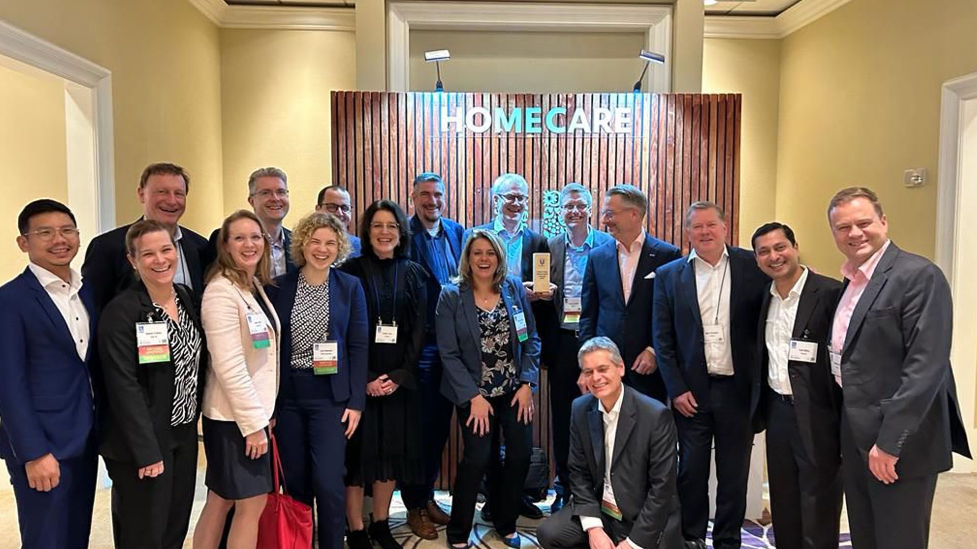 Willem Uijen, Unilever’s Chief Procurement Officer, with a team of people at a Home Care business group event.