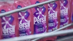 Multiple pink bottles of Wonder Wash lined up.