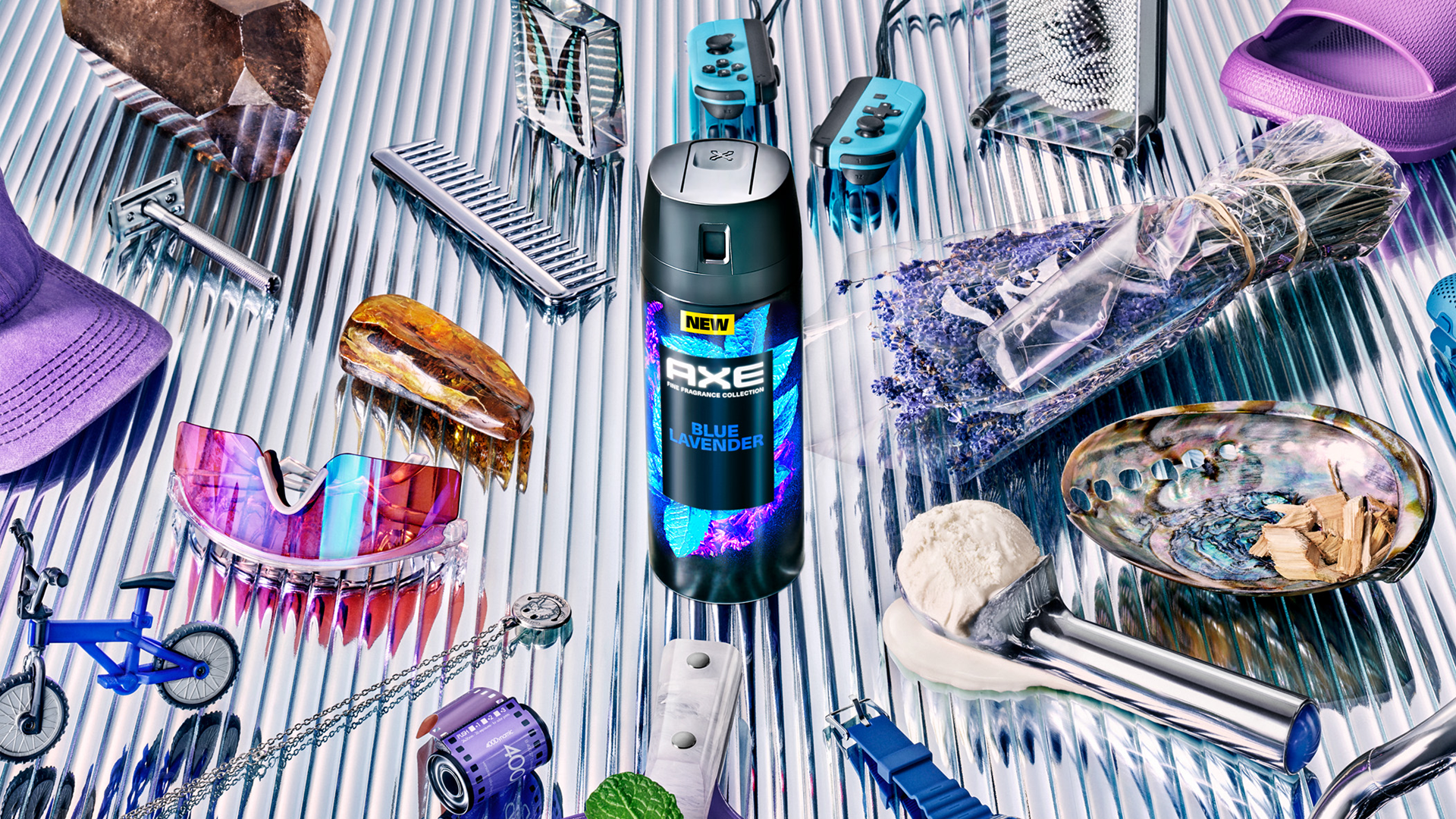 A can of Axe Blue Lavender body spray from the brand’s Fine Fragrance collection, surrounded by miscellaneous items.