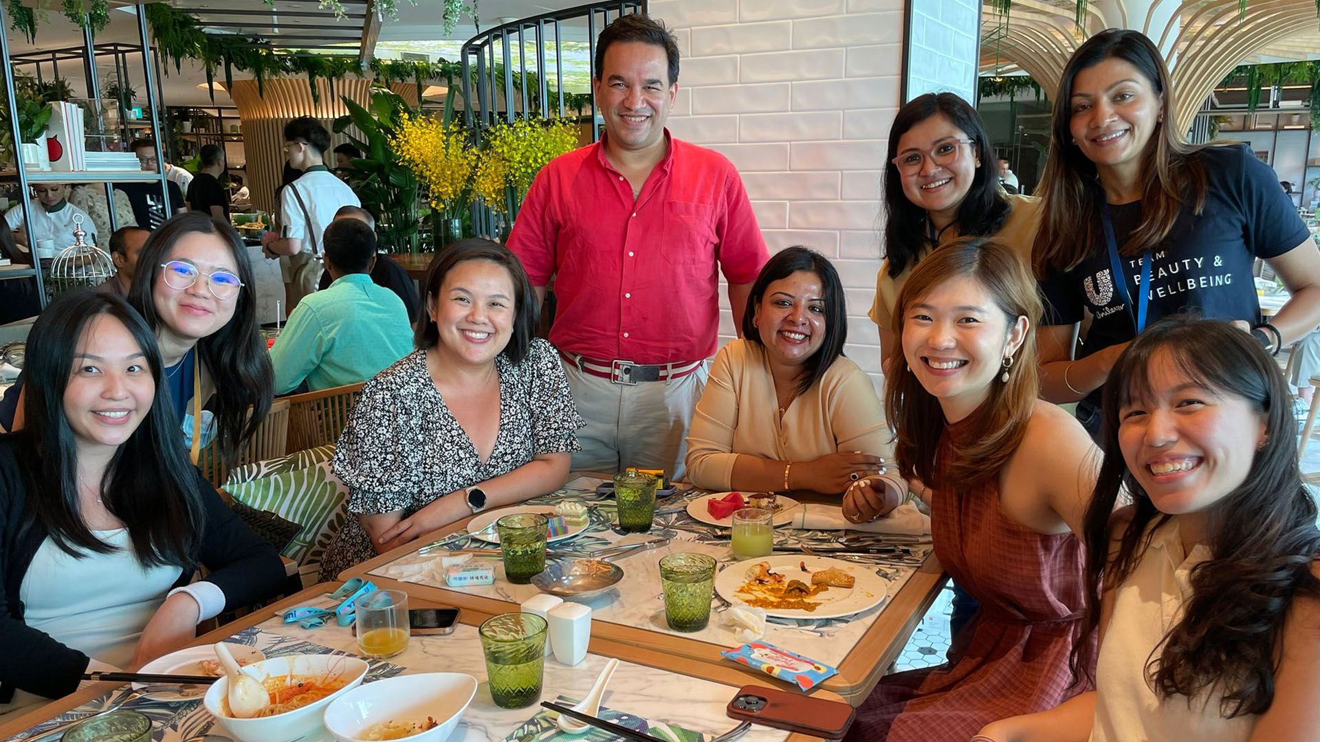 Unilever International CEO Aseem Puri with team members at a lunch celebrating the business crossing €1 billion in sales.