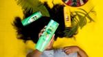 Woman holding one of Sunsilk's new shampoos whose coconut fragrance was inspired by naturehas context menu