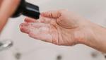 A person washing their hands with soap