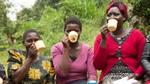 A group of women sitting and drinking from mugs