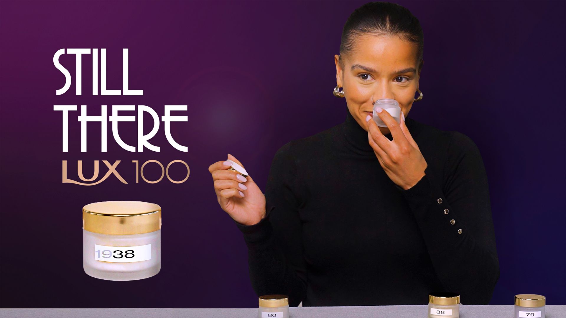 A person with a happy facial expression smelling a selection of LUX products which show date labels from the years 1938, 79 and 80. Alongside are the words “Still there – LUX 100”. 