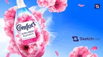 A bottle of Comfort fabric conditioner with pink cherry blossom flowers created with Sketch AI content creation.