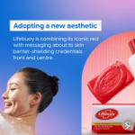 Text describing Lifebuoy’s updated aesthetic sits on a blue and pink background, alongside images of a red Lifebuoy soap bar and its packaging. A person’s neck and upper back are shown with soap lather.
