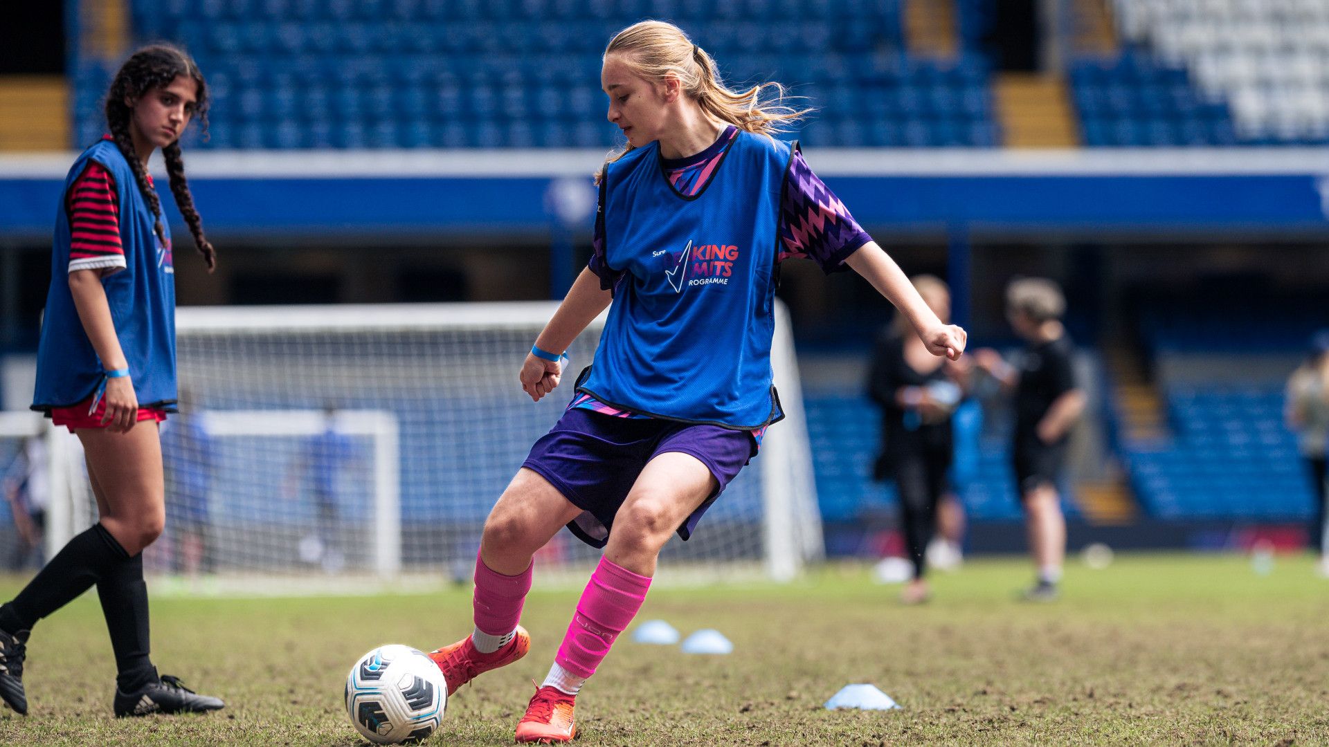 Young girl playing football as part of the Rexona’s Breaking Limits Programme at Chelsea Pitch day event.
