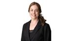 Rianne Buter, Unilever’s Global Head of Sustainability. A white woman with brown hair and a black suit, smiling.