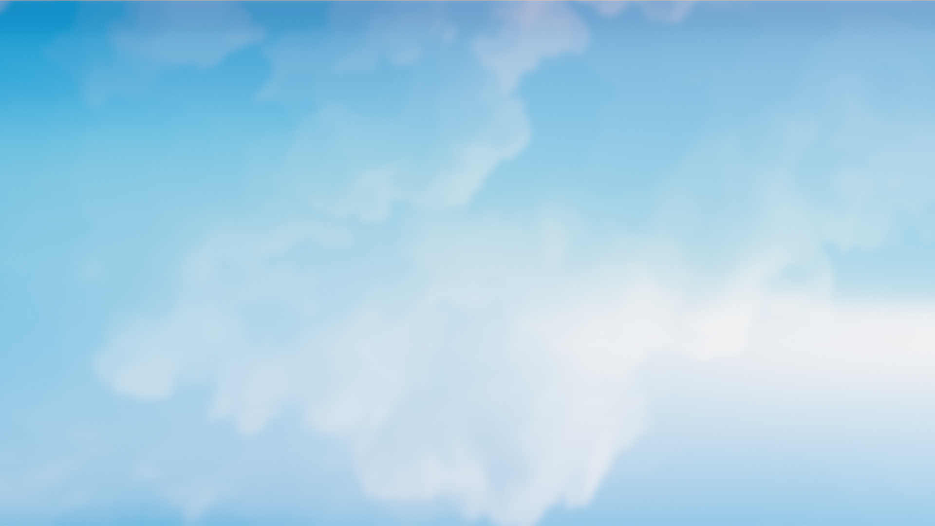 Soft white clouds against a bright blue sky