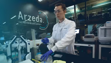 An image of a man working in a laboratory at Arzeda